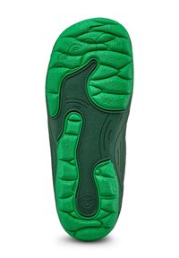Grüne Gummisohle für Schuhe mit strukturierten Grip-Mustern und Konturen für Traktion, mit einem markanten Designelement, das einem Gesicht ähnelt.