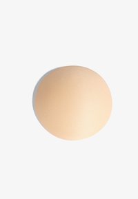 Niewybrane, beżowe okrągłe wkładki