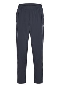 Diepblauwe sportbroek met een elastische tailleband, twee zijzakken en witte bies langs de zijkanten. Glad textuur, lichtgewicht stof.