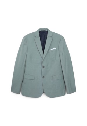 Hellgrüner Blazer aus strukturiertem Stoff, mit einem einreihigen Design, zwei Fronttaschen und einem weißen Taschentuch.