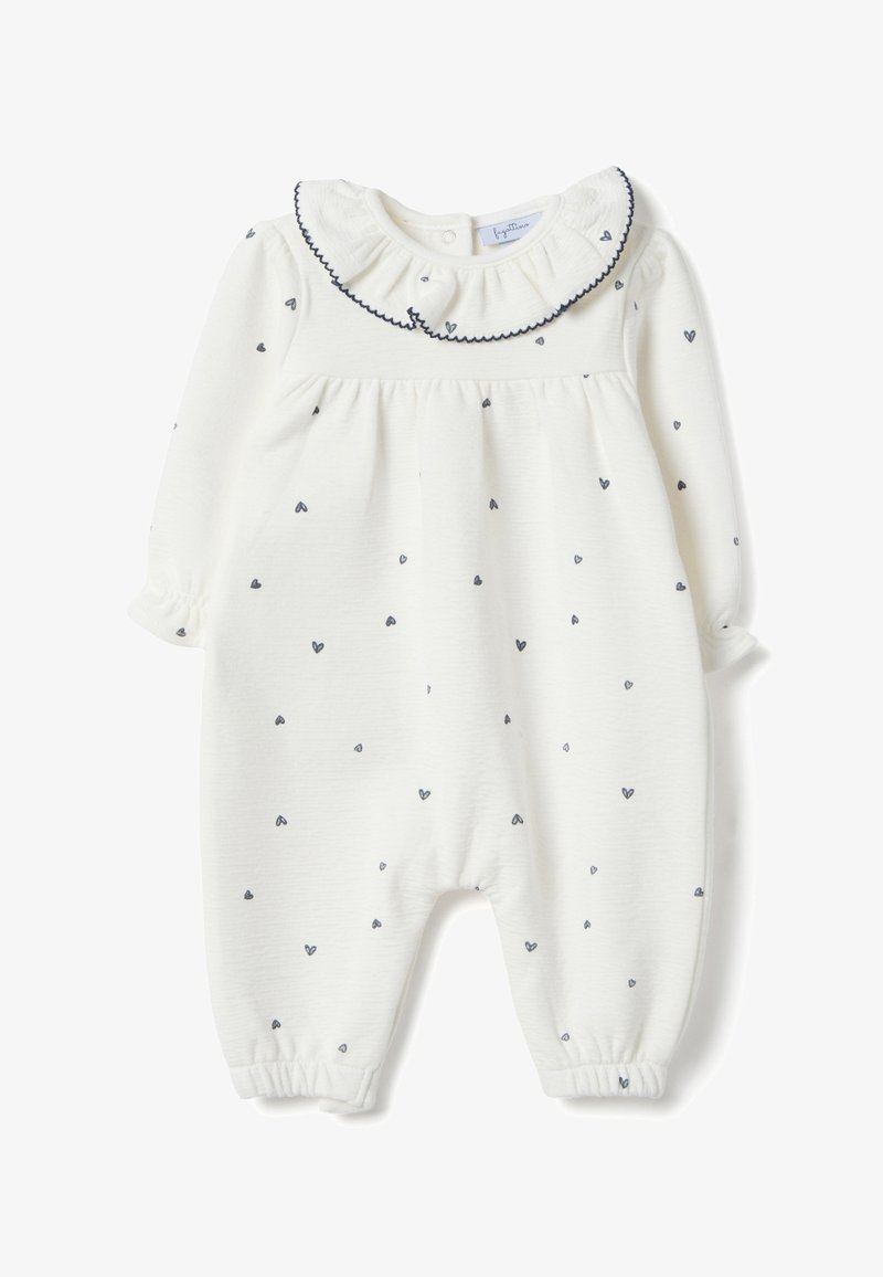 Body de algodón blanco con mangas largas, cuello con volantes y patrones de corazones en azul marino. Cuenta con puños elásticos en muñecas y tobillos para un ajuste ceñido.