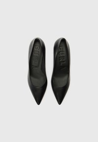 Black leather high-heel shoes with a pointed toe design and smooth texture. Features embossed "FURLA" branding on the insoles.