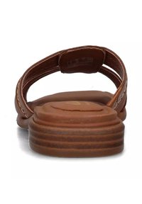 Sandal in pelle marrone con suola piatta e rigata e due cinturini sottili. La texture è liscia, con cuciture sottili sui cinturini.