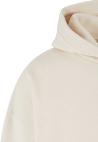 Beige Kapuzenpullover aus weichem, strukturiertem Stoff, mit lockerer Passform und Kordelzugkapuze. Das Design verfügt über minimalistische Nähte und klare Linien.