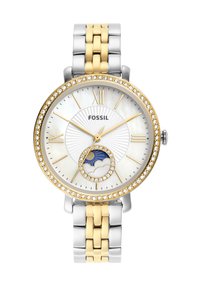 Montre Fossil avec un bracelet en métal bicolore, or et argent. Cadran rond avec un fond en nacre, accents en pierres et fonction phase de lune.