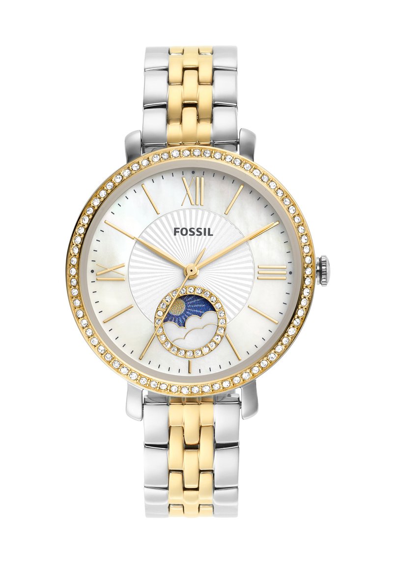Montre Fossil avec un bracelet en métal bicolore, or et argent. Cadran rond avec un fond en nacre, accents en pierres et fonction phase de lune.