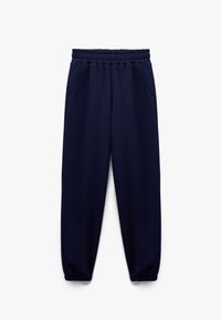 Marineblå sweatpants lavet af et blødt stof, med et elastisk talje, to sidelommer og elastiske manchetter ved anklerne.