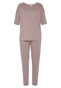 Soft, mauve loungewear set featuring a short-sleeve top with "FALL IN LOVE" text and matching elastic waist pants. Smooth, stretchy fabric.