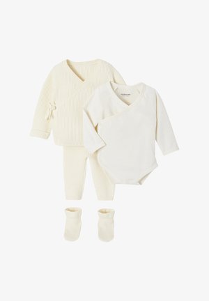 Three-piece cream baby set with wrap-style long-sleeve top, ribbed pants, matching knit cardigan, and pair of booties.