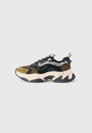 Chunky sneaker with black, olive, and zebra print fabric, beige speckled sole, black laces, and Steve Madden logo on the side.