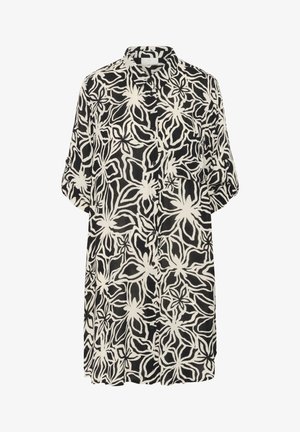 Mustvalge lilleline särgikleid, millel on nupuga esiosa, rullitavad varrukad ja vabalt langev lõige. Omab julget, pidevat lillemustrit.