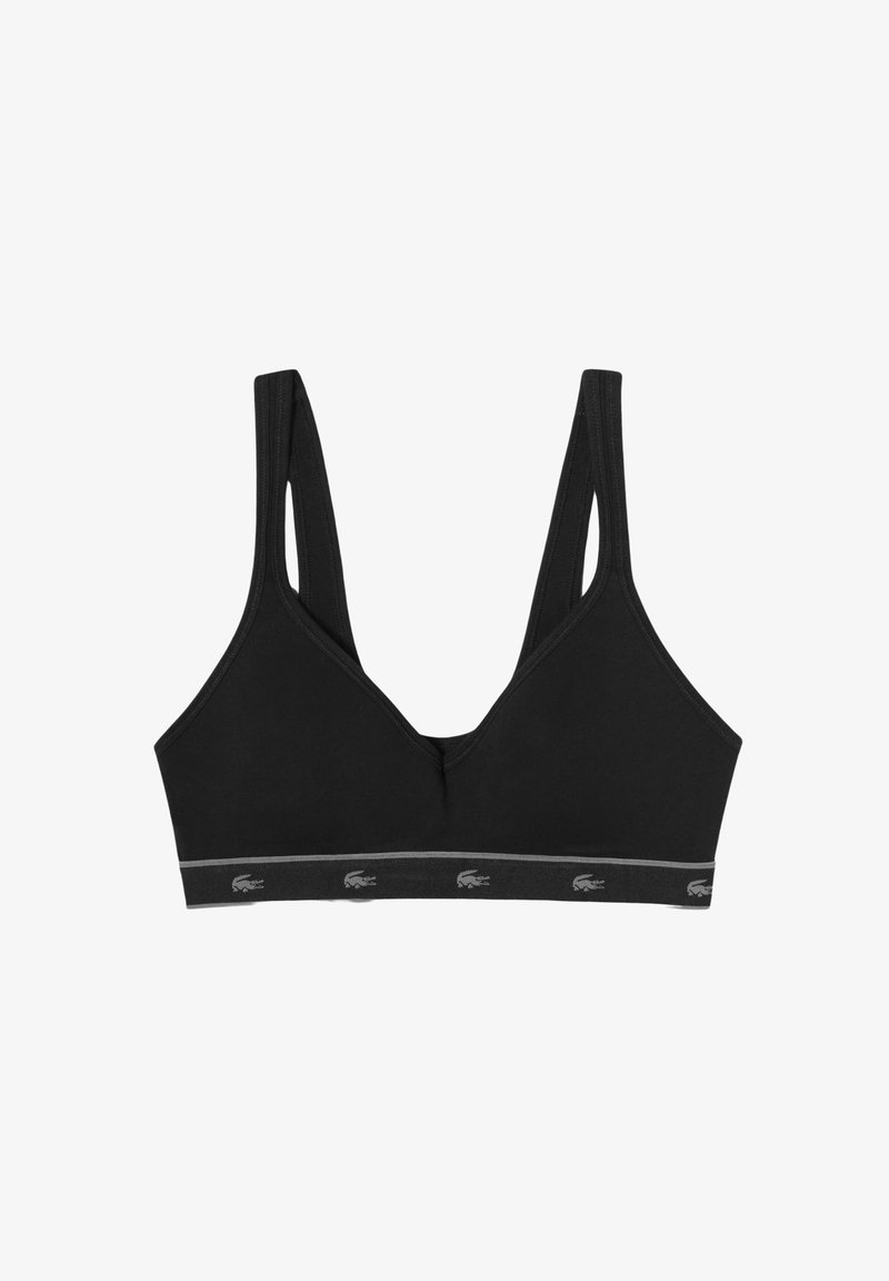 Svart sports-BH laget av mykt stoff, med V-halsdesign, tykke stropper og logo-detalj på det elastiske båndet nederst.