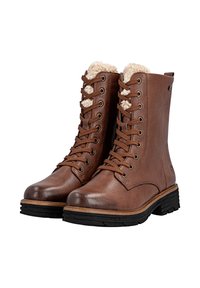Bruine leren veterschoenen met nepbont aan de bovenkant, gestructureerd oppervlak, ronde neus en dikke zwarte rubberen zool.