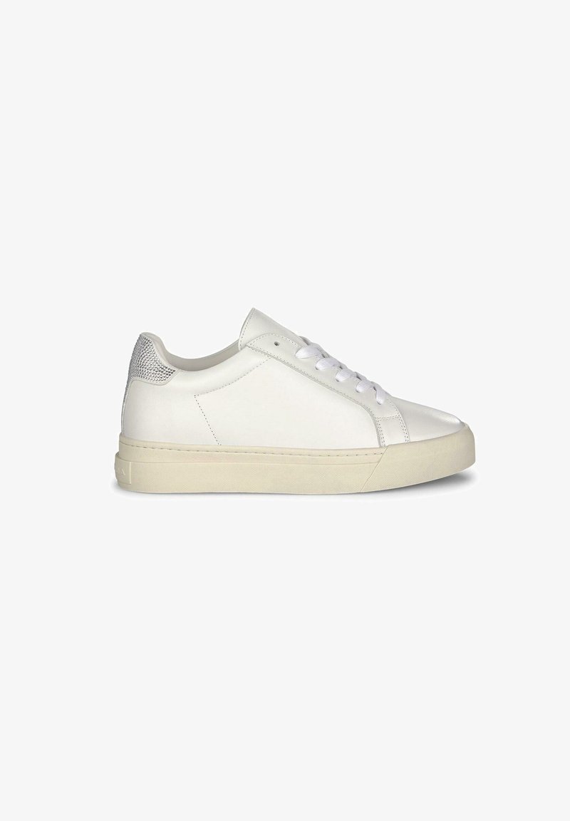 White leather sneaker with a smooth texture, featuring a rounded toe, flat laces, and a gray accent at the heel. Rubber sole.