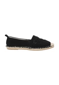 Espadrille negra con parte superior de tela, diseño floral texturizado y suela de yute trenzado. Presenta un borde cosido y una lengüeta en la parte posterior.