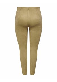 Leggings taille haute ajustés en faux suède doux et léger couleur brun clair. Texture lisse sans coutures visibles ni embellissements.