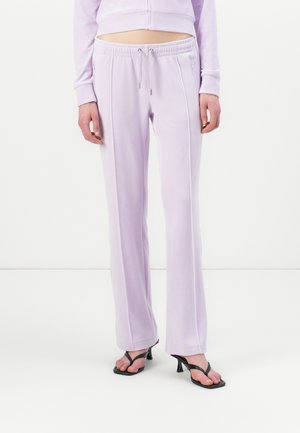 Lilac jogger pants made of smooth fabric, featuring an elastic waistband with drawstring, side seams, and a relaxed fit.