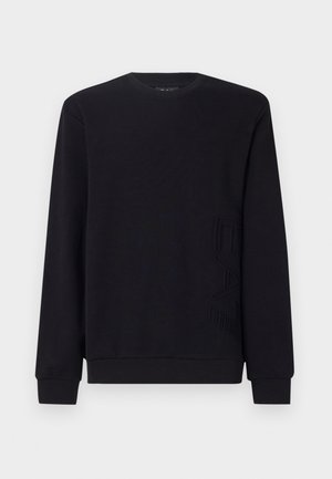 Felpa nera realizzata in tessuto morbido; presenta un collo rotondo, maniche lunghe e un logo "EAC" in rilievo sul lato sinistro in basso.