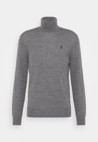 Grå polotröja i mjukt stickat material. Har långa ärmar och en liten broderad logotyp på vänster bröst.