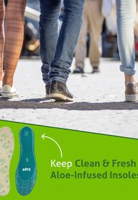 Aloe-infused insoles feature a light tan patterned upper and a blue textured base. Scene includes three pairs of feet on a sidewalk.