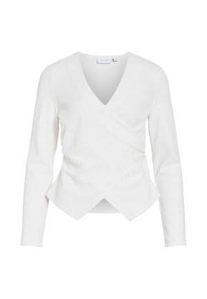 Blouse blanche à manches longues de style cache-cœur avec col en V et ourlet avant asymétrique superposé.