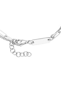 Silver chain bracelet featuring a flat rectangular tag, a lobster clasp, and a multiple-link extension chain for adjustable length.