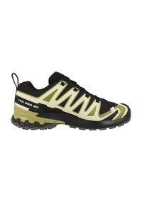 Scarpe sportive nere e verde chiaro con una tomaia testurizzata, dettagli in rete e una suola resistente. Presenta una linguetta sul tallone.