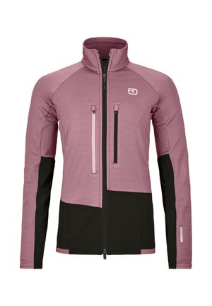 Fitted long-sleeve jacket in mauve and black with stand collar, front zipper, two vertical chest zip pockets, and logo on left chest.