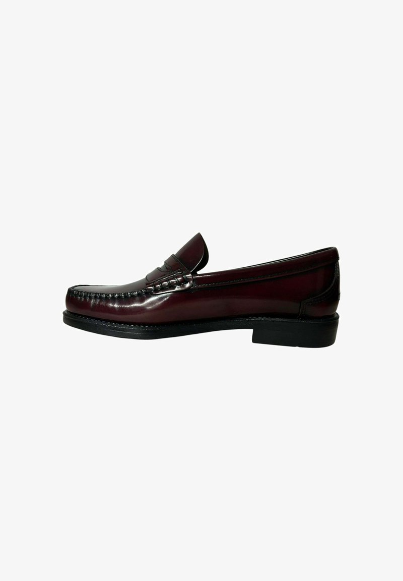 Burgundy leather loafers with a smooth finish, featuring stitching details and a low black sole. Classic design with raised seam accents.