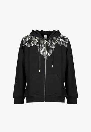 Felpa nera con zip realizzata in tessuto morbido, con design grafico di serpenti intrecciati bianchi sulla parte superiore frontale. Include tasche.