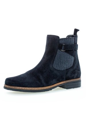 Black suede ankle boot with textured elastic side panels and a brown stitched sole. Features a small loop at the back for easy wear.