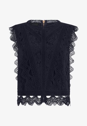 Black sleeveless lace blouse with floral patterns, scalloped edges, and a gold back zipper closure.