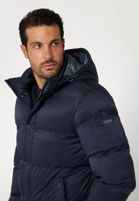 Guess Giacca invernale - blau