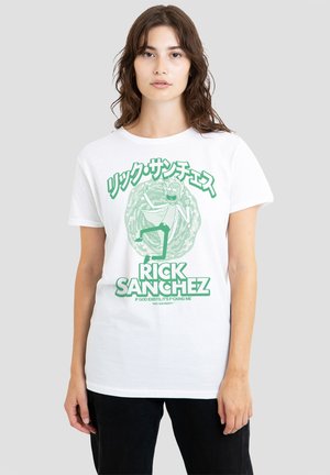 Young woman wearing white T-shirt with green graphic of Rick Sanchez from Rick and Morty and Japanese text above the character.