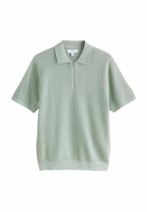 Hellgrünes, kurzärmliges Poloshirt mit einem strukturierten Strickmuster. Verfügt über einen halben Reißverschluss und einen klassischen Kragen. Weicher Stoff.
