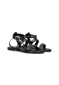 Zwarte leren sandalen met meerdere banden, voorzien van gouden hardware accenten. Plat zoolontwerp met open zijkanten voor ademend vermogen.