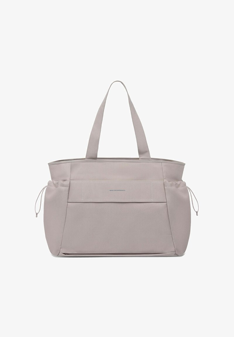 Hellgraue Tragetasche mit doppelten Schulterriemen, großer Vorderseite und verstellbaren Seiten mit Kordelzugverschluss.