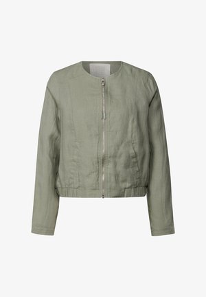 Veste en lin vert clair avec un col rond, fermeture éclair, taille élastique et poches latérales. Texture douce, design cropped.