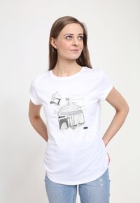 Biała koszulka z krótkim rękawem z czarno-szarym rysunkiem kopułowatej konstrukcji z technicznymi detalami. Wykonana z miękkiej bawełny.