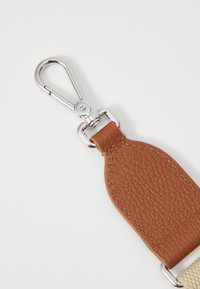 Brown textured leather strap with silver hardware and a clip attachment. Smooth, durable finish with contrasting stitching detail.