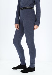 Marineblå leggings med tætsiddende design lavet af strækbart stof. Har en sort talje med "SWEDEMOUNT"-logo. Glat tekstur.