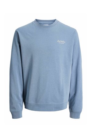 Sininen collegepaita pyöreällä kaula-aukolla ja pitkillä hihoilla. Valmistettu pehmeästä puuvillakankaasta, jossa on hillitty valkoinen logo rinnassa.