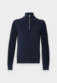 Marineblauwe wollen zip-up trui met een hoge kraag, geribde manchetten en zoom. Bevat een klein logo op de borst. Gladde textuur.