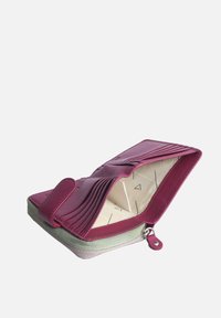 Vibrant magenta wallet with smooth leather, zippered closure, and multiple card slots. Lined interior features a geometric pattern.