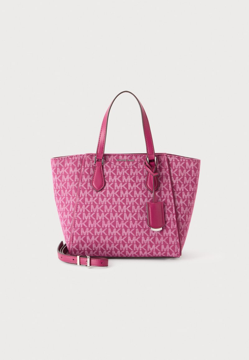 Sac cabas rose Michael Kors avec motif répété du logo MK, deux poignées, bandoulière amovible et accessoire tag en cuir.