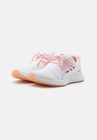 White athletic shoes with a textured design, pink laces, and a light orange rubber sole. Features padded collar and logo detail on the tongue.