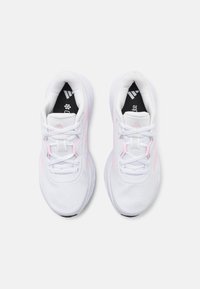 White athletic shoes with a breathable mesh upper, featuring light pink accents, a cushioned sole, and white laces. Black logo on the insole.