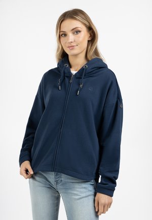 Marineblauwe zip-up hoodie van zachte stof, met een capuchon met trekkoord, een kangoeroezak en geribbelde manchetten. Subtiel logo op de borst.