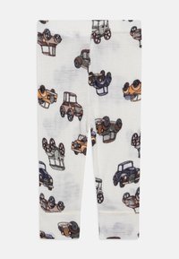 KCotton leggings med et mønster av gamle biler i svart, brunt og oransje på en hvit bakgrunn. Myk, elastisk stoff.