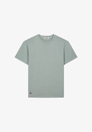 Lichtgrijs T-shirt met korte mouwen en ronde hals, met een klein rond logo bij de onderzoom aan de linkerkant.